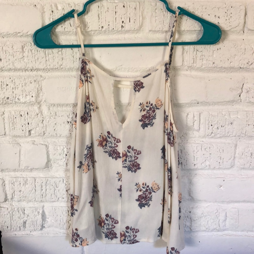 Cream tank top with floral print.